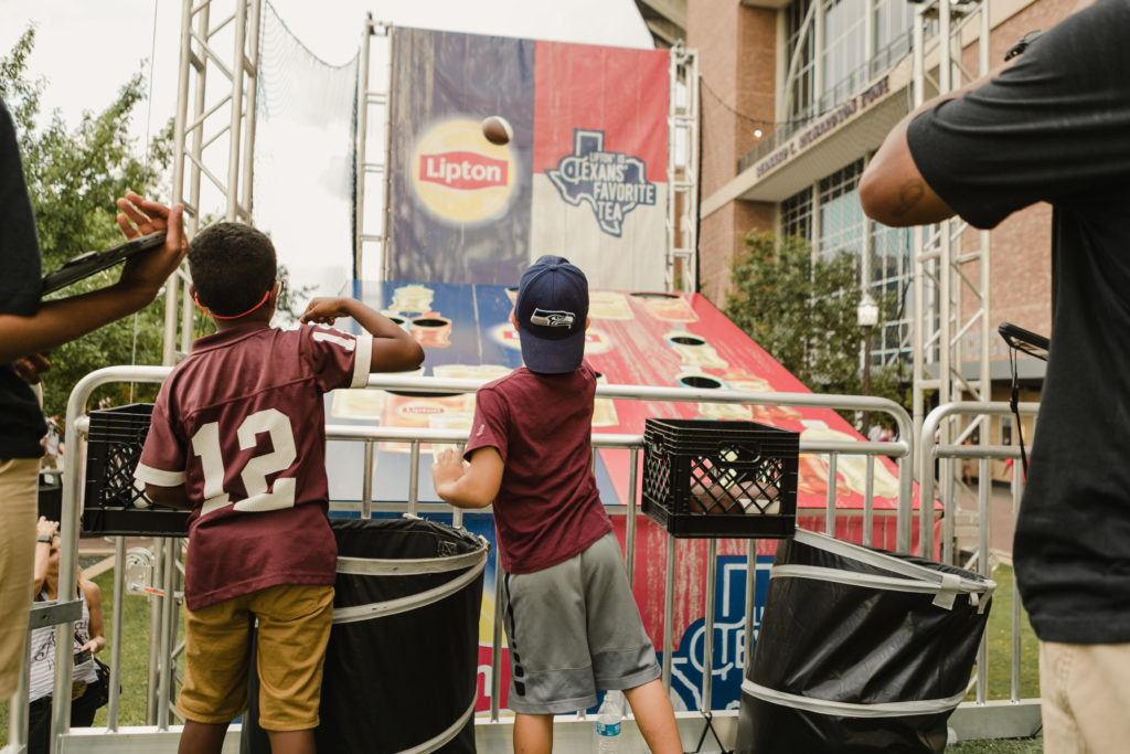 Fans competing at Lipton experiential marketing for tailgates activation